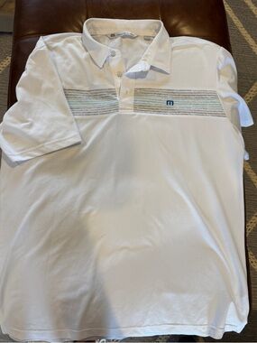 Travis Mathew White Polo with Subtle Blue and Tan Stripe Chest